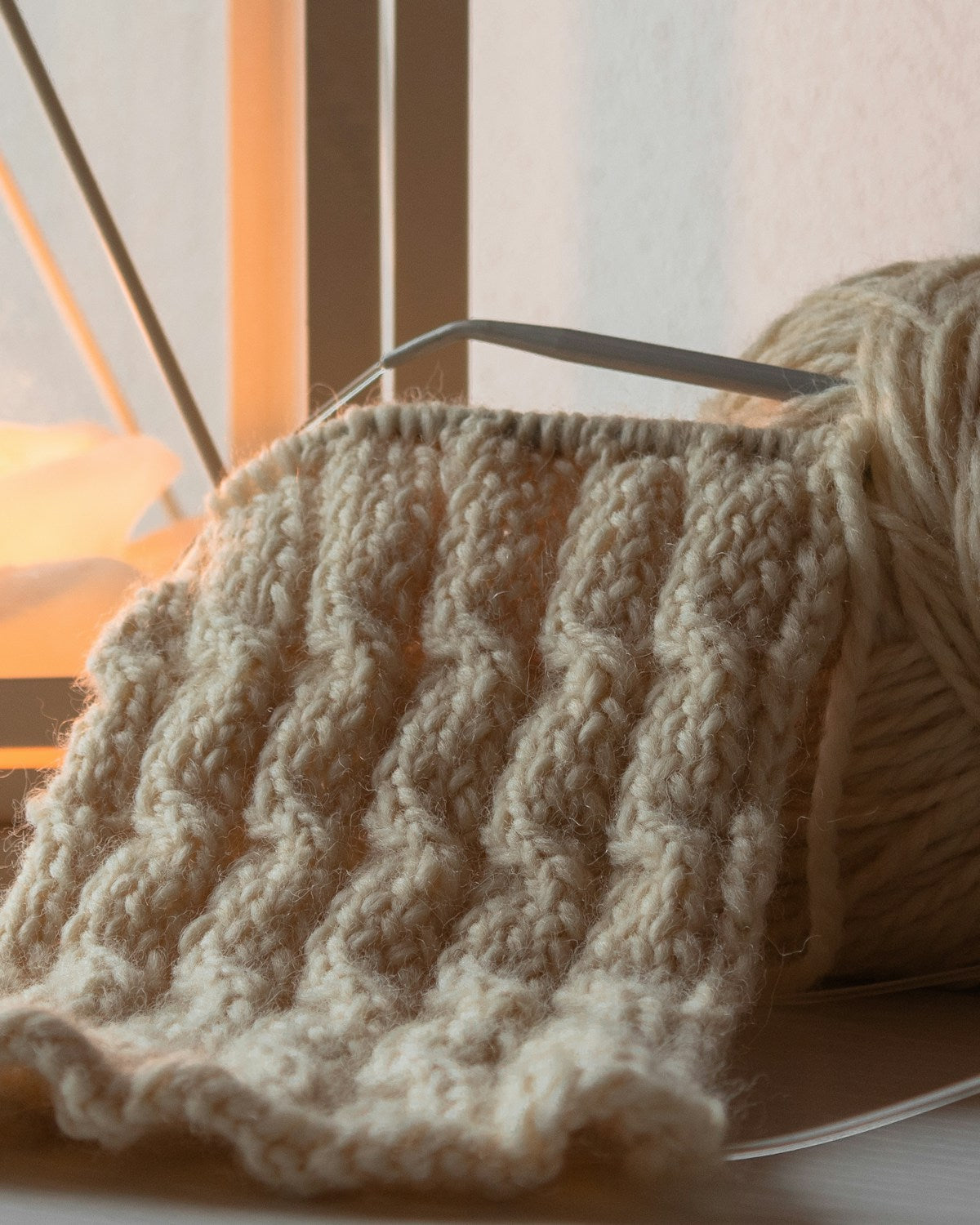 Knitted wool and candlelight